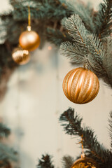 Beautifully crafted Elegant Golden Christmas Ornaments strikingly displayed while hanging...