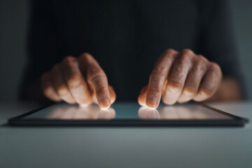 Closeup of businessman’s hands scrolling on tablet — professional, sleek interaction with digital touchscreen