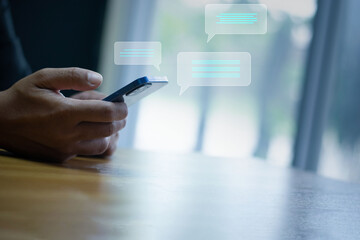 Man hands chatting talking on phone with chat icon