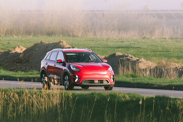 Eco friendly vehicle moves along peaceful landscape