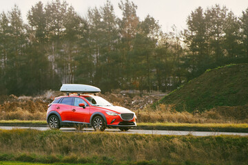 Fototapeta premium Outdoor adventure SUV with roof-mounted cargo box