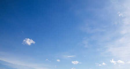 the sky is blue with fluffy white clouds.