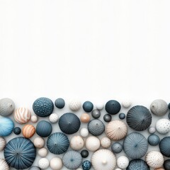 Abstract arrangement of various decorative spheres in different colors and textures on a white background for artistic and design inspiration
