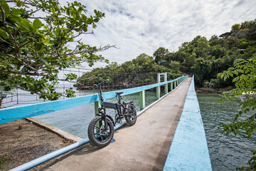 ebike e-mountain on a suspension bridge pedestrian bridge off-road