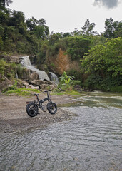 ebike e-mountain bike at a waterfall offroad