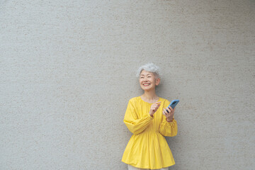 Smiling senior woman using a smartphone