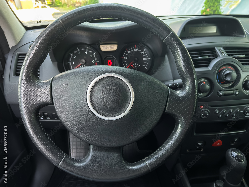 Poster imagine a stylish dashboard with a luxurious steering wheel in a modern car, featuring a detailed in