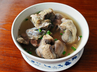 fresh stewed pork in the soup in the bowl for eating