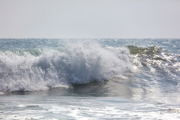 The ocean is calm and the waves are small