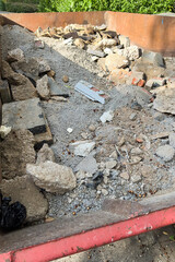 A detailed and closeup view of various types of construction debris found in a dumpster, showcasing...