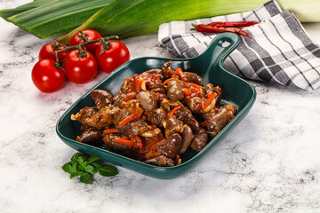Baked chicken hearts with vegetables