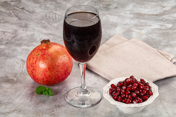 Sweet fresh pomegranate juice with fruit