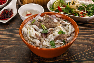 Vietnamese Pho Bo soup with beef and noodles