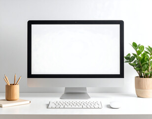 Fototapeta premium A modern computer monitor with a blank screen sits on a white desk, alongside a keyboard and mouse, with a small potted plant.