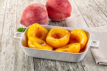 Sweet ripe yellow canned peaches