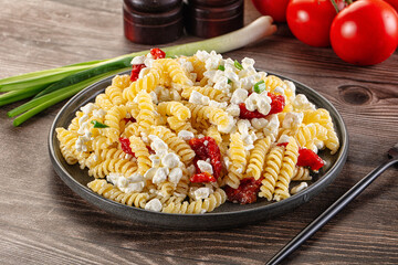 Italian pasta fusili with curd