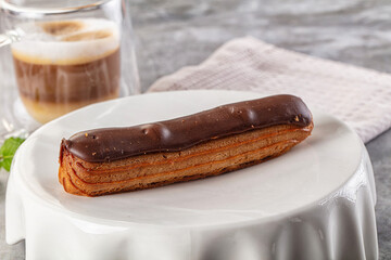 Gourmet chocolate eclair with icing