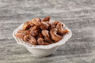 Unpeeled cashew nuts in the bowl