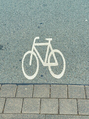 The marking for bicycles on the asphalt road surface clearly indicates where the bike lane is...