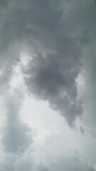 Heavy Dark Clouds Stretch Across White Glowing Distant Mountain Ridge