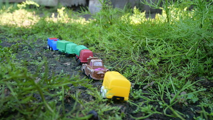 Children's toy vehicles explore rainforest trails, inspiring adventure, imagination, and outdoor jungle play experiences.