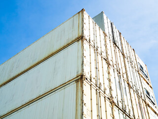 Cargo ship container goods export import international transport on blue sky background, warehouse...