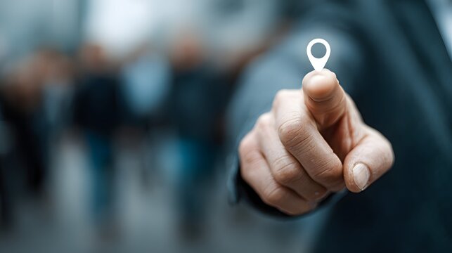 Person pointing with a location pin icon on their finger