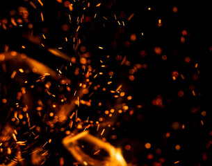 A black background with a lot of orange sparks