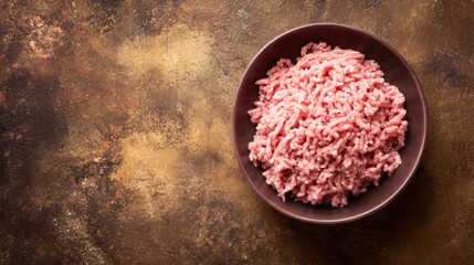 Fresh raw ground meat in a bowl ready for cooking. Perfect for delicious recipes and meal preparation.