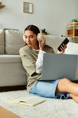 Young woman enjoys a cozy afternoon at home while multitasking with technology