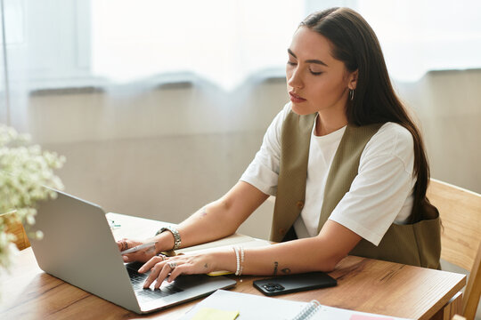 Young woman enjoys productive time at home while working on her laptop in a cozy space