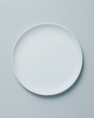 Curved Ceramic Plate on Light Gray Background with Soft Top-Down Lighting