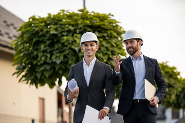 Engineers coordinating project with digital tools