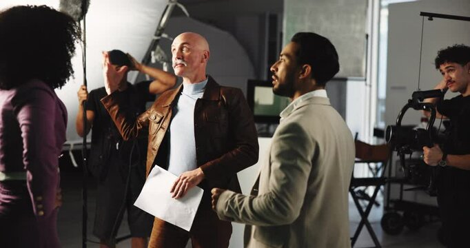 Angry actor, production and people with conflict in studio for poor script, bad writing or shouting. Group, frustrated and backstage on set for fail, argument or stress for disaster with movie delay