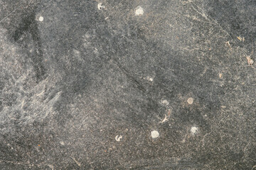 Close-up photograph of a gray, textured surface. Classic, elegant and charming textured background...