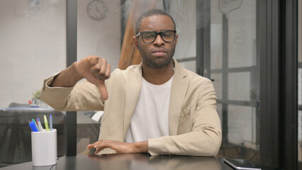 Portrait of African Man with Thumbs Down