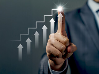 Businessman's hand touching a digital screen displaying a financial graph, symbolizing business growth and market success