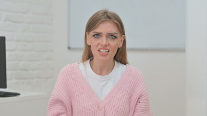 Portrait of Shocked Creative Young Woman with Loss