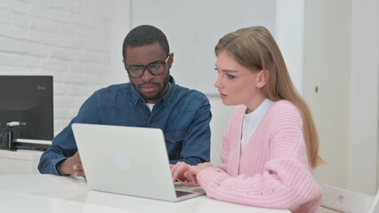 Young Teammates Working on Laptop Together