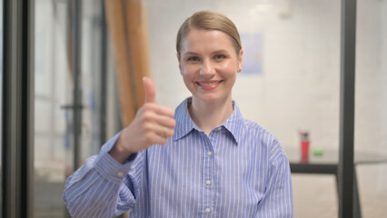 Thumbs up by Creative Young Woman, Portrait