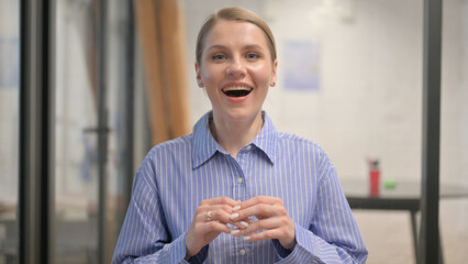 Portrait of Surprised Creative Young Woman Enjoying Win