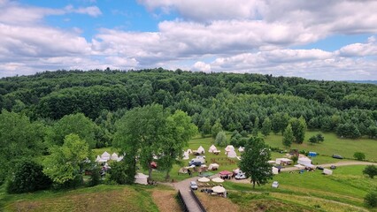 a fair in a meadow near the forest