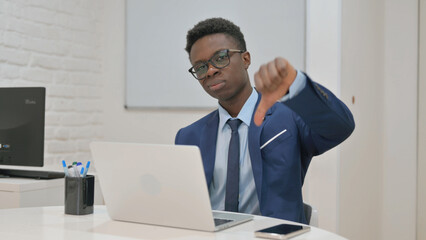 Naklejka premium Young African Businessman Showing Thumbs Down