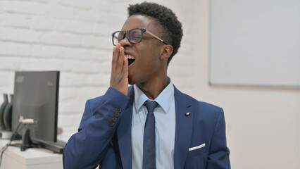 Yawning Businessman at Work Need Rest