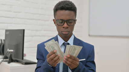 Portrait of African Man Counting Money