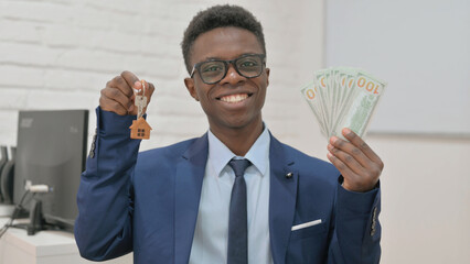 African Man Holding Keys and Money