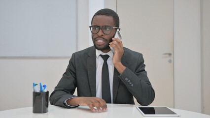 Talking Businessman Engaged in a Phone Call