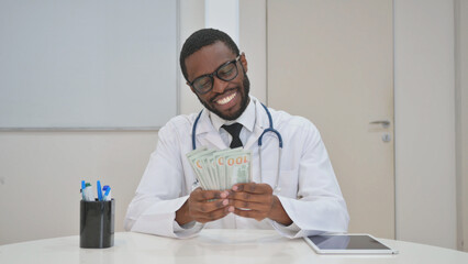 Doctor Counting Money with a Smile