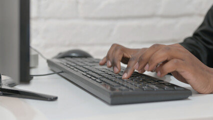 Close-up of Businessman Hands Typing on Keyboard
