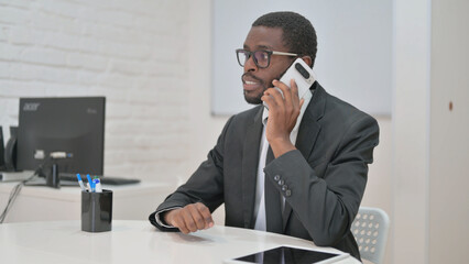 Talking Businessman Engaged in a Phone Call